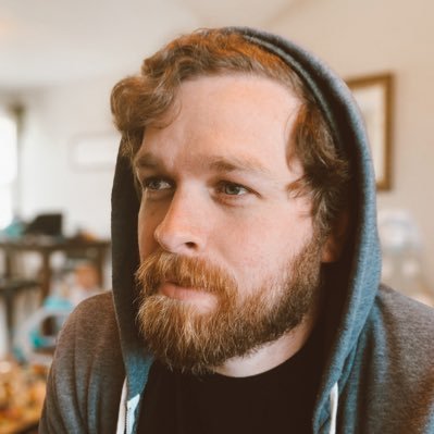 Drew sitting at his desk